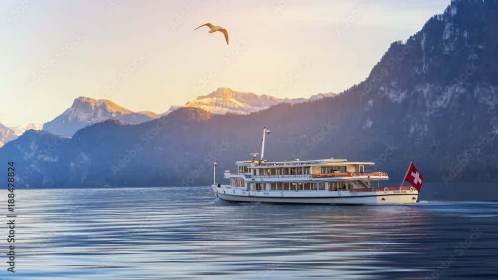 ferry on lake lucerne at sunset