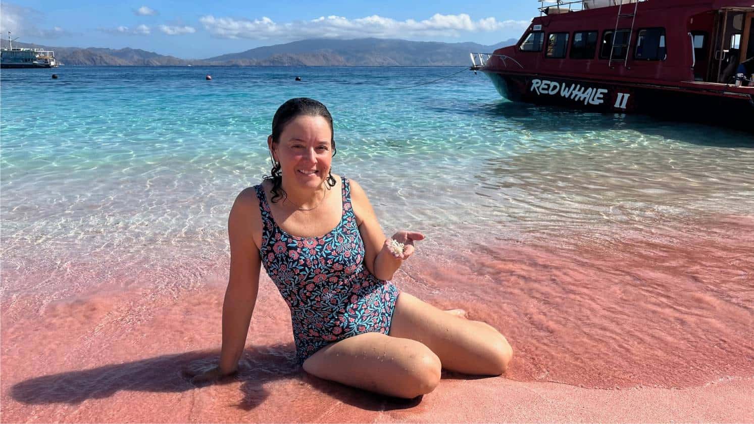 sitting on pink beach