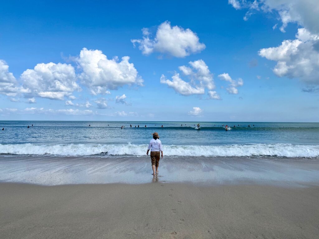 walking on beach with waves