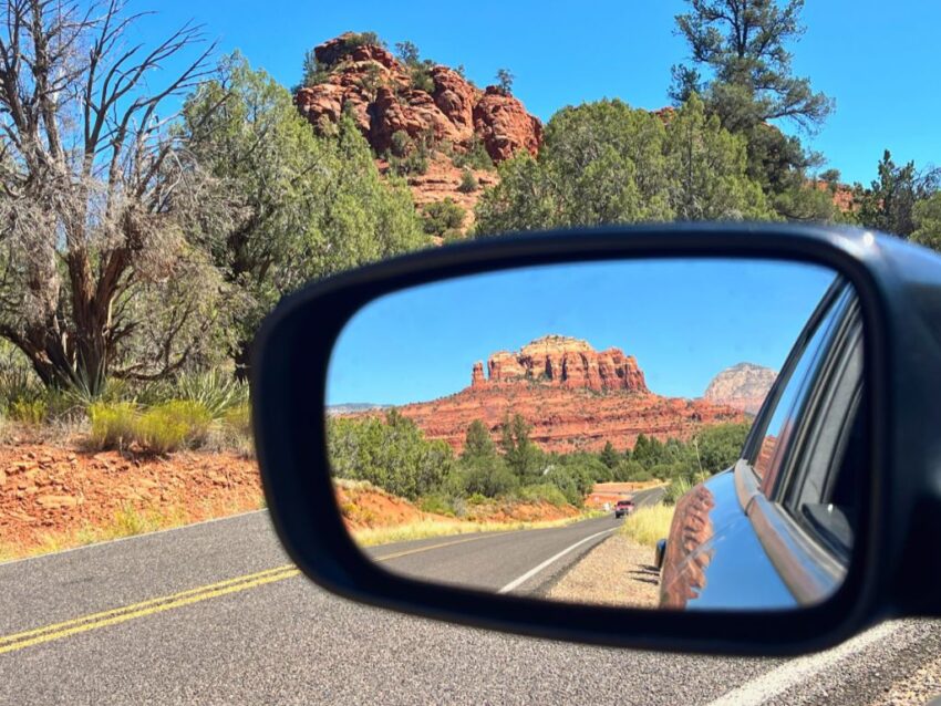 Red Rocks of Sedona in rearview mirror