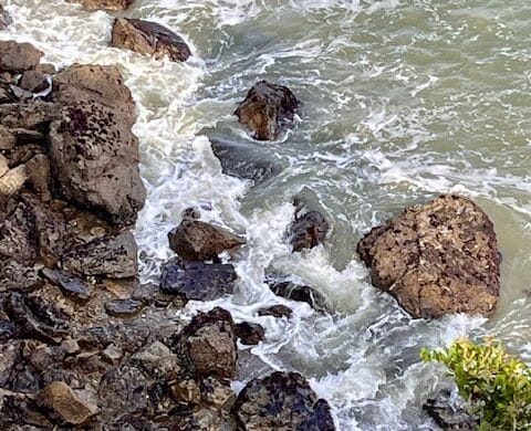 waves crashing over rocks