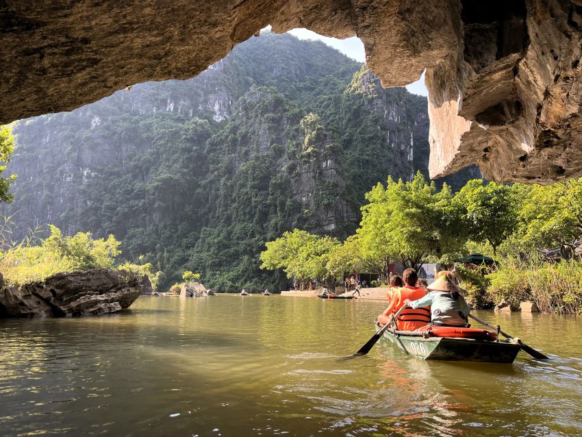 Boat coming out of cave at Trang An