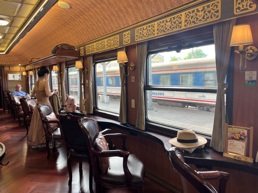 Interior of the heritage train from Da Nang to Hue, with wooden paneling and leather seats