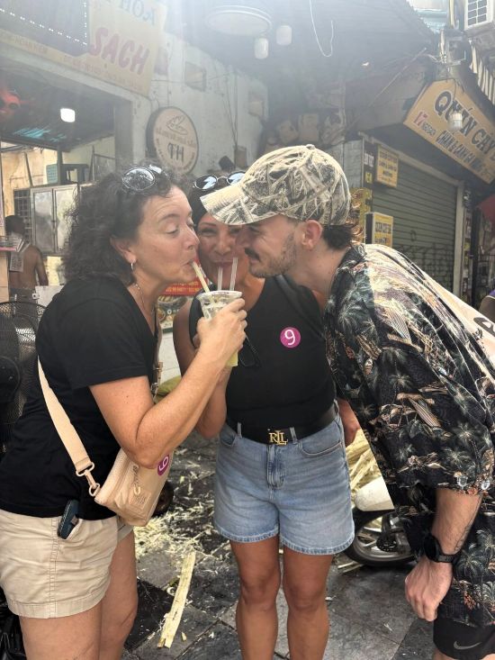 Me with other solo travelers on Hanoi food tour