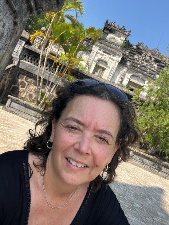 Selfie with tomb behind me